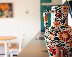 Detailed close-up of decorative vase in the kitchen of Royal Dune 4, Callantsoog.