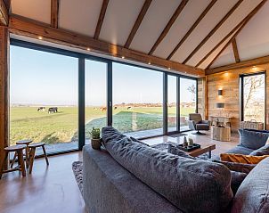 View of meadow from living room of De Bonte Specht vacation home in Callantsoog, North Sea coast.