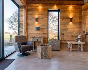 Comfortable reading corner in De Bonte Specht vacation home in Callantsoog, North Sea coast.