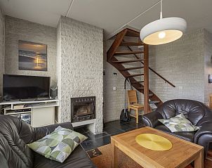 Comfortable sitting area with fireplace in Abbestederweg 24A Callantsoog vacation home