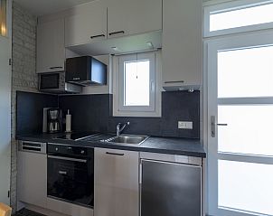 Modern kitchen with appliances in Abbestederweg 24A Callantsoog vacation home