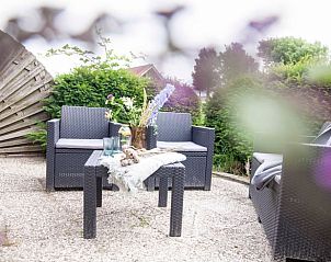 Sunny terrace at Holiday home in Callantsoog, North Sea coast, North Holland, with comfortable seating.
