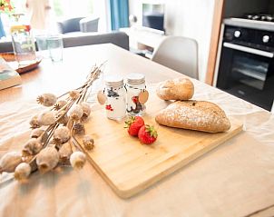 Breakfast on the table at Holiday Home in Callantsoog, North Sea Coast, North Holland, with fresh fruit and yogurt.