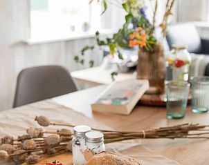 Dining table with decoration in Holiday home in Callantsoog, North Sea coast, North Holland, ready for a meal.