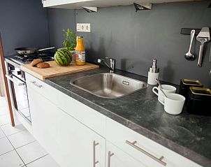 Compact kitchen in Holiday home in Callantsoog, North Sea coast, North Holland, with fresh ingredients.