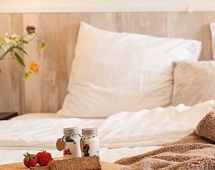 Detail of a comfortable bed in Holiday home in Callantsoog, North Sea coast, North Holland.