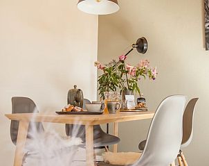 Cozy dining area in Cottage in Callantsoog, vacation home on the North Sea coast in North Holland.