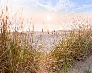 Breathtaking sunset at Cottage in Callantsoog, vacation home on the North Sea coast in North Holland.