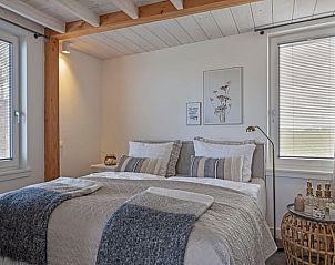 Comfortable bedroom in Cottage in Callantsoog, vacation home in North Holland with luxury bedding.