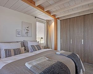 Spacious bedroom in Cottage in Callantsoog, vacation accommodation on the North Sea coast with modern furnishings.