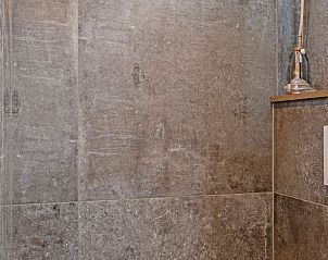 Detail of the shower in Cottage in Callantsoog, vacation home on the North Sea coast with modern tiles.