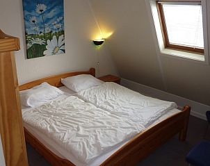 Bedroom with double bed in Zwanenwater 1 vacation home, Callantsoog, North Sea coast, North Holland.