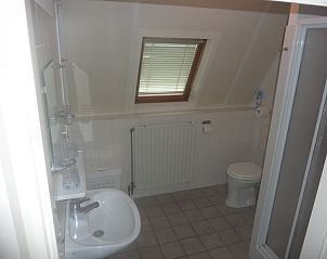 Bathroom of Zwanenwater 1 vacation home in Callantsoog, North Sea coast, North Holland with shower and sink.