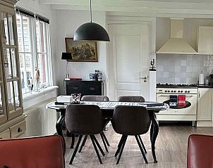 Adembenemende zonsondergang nabij vakantiehuis NH043 in Groet, Noordzeekust, Noord-Holland aan het strand.