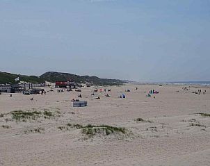 Schitterende zonsondergang boven het water nabij vakantiehuis NH043 in Groet, Noordzeekust, Noord-Holland.