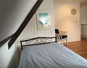 Uitzicht op het strand en de zee vanaf NH072 vakantiehuis in Groet, Noordzeekust.