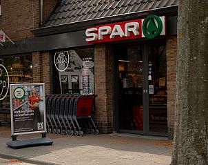 Gezellig terras bij NH496 vakantiehuis Groet Noordzeekust met comfortabele zitplaatsen.