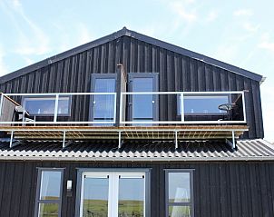 Balkon van Hooizolder appartement aan de Noordzeekust in Camperduin, ideaal voor ontspanning.