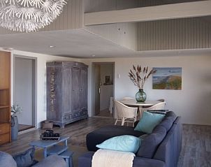 Spacious living room in Duinroos Cottage, a vacation home in Egmond aan den Hoef on the North Sea coast, North Holland.