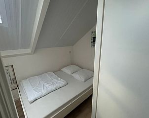 Stijlvolle slaapkamer in Vakantiehuisje in Burgerbrug, Noordzeekust, Noord-Holland.