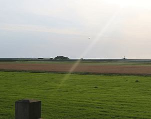 Weids uitzicht over de velden bij Vakantiehuisje in Burgerbrug, Noordzeekust, Noord-Holland.