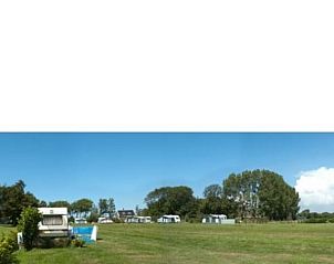 Uitgestrekt landschap rondom Huisje in Schagerbrug, Noord-Holland, ideaal voor kampeerliefhebbers aan de Noordzeekust.