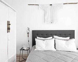 Erholsames Schlafzimmer in der Villa Beau Lieu, Bergen, mit modernem Design und bequemen Betten.