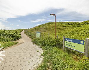 Balkon met uitzicht in vakantiehuis NH385, Julianadorp aan Zee, Noord-Holland.