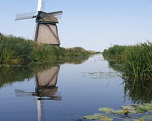Traditionele molen in de omgeving van Huisje in Oudesluis, vakantiehuis in Noord-Holland.
