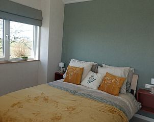 Comfortabele slaapkamer in Vakantiehuisje in Schagen met rustgevend uitzicht in Noord-Holland noord.