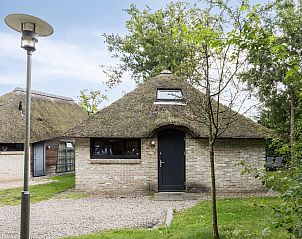 Detached house in Schoorl, North Holland, offers a charming thatched cottage surrounded by green nature and rustic surroundings.