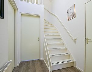 Bright hall with staircase in the Detached house in Schoorl, North Holland North, ideal vacation home for families.