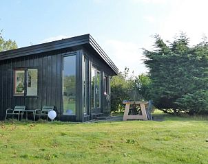 Vacation home in Schoorl, North Holland, surrounded by greenery with a sunny terrace for a relaxing stay in nature.
