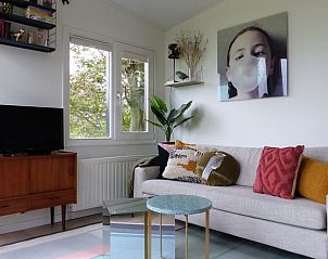 Cozy living room of Holiday Home in Schoorl, North Holland, with comfortable sofa and modern furnishings for a relaxing stay.