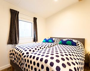 Cozy bedroom in Holiday home for 4 people, vacation home in Berkhout, North Holland, with comfortable beds and light interior.