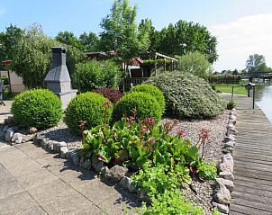 Verblijf 490326 - Vakantiewoning IJsselmeerkust - huisje 143, bootje, aan het water, grote tuin en terrassen