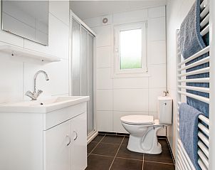 Modern bathroom in the Rialto holiday home for 5 people in Berkhout, North Holland, with sleek design and comfortable amenities.