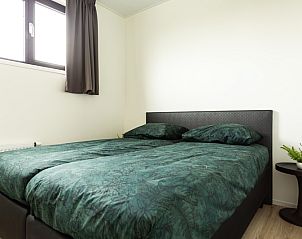 Attractive bedroom in Module Special 6 persons Wellness in Berkhout, North Holland, with comfortable double bed and modern furnishings.