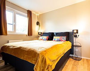 Cozy bedroom in Leijhoeve vacation home for 6 people in Berkhout, North Holland, with comfortable double bed and warm decor.