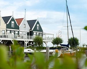 Zuiderzee Luxury 6 Ferienhaus in Uitdam, Amsterdam eo, Nordholland mit Blick auf Segelboote und Wasser, umgeben von Natur.