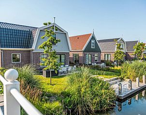 Buitenkant van Vakantiehuis Florijn 6, Uitdam, Amsterdam eo, Noord-Holland met groene omgeving.