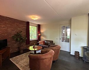 Vakantiehuis in Nutter, sfeervolle woonkamer met houtkachel in vakantiehuis Twente, Overijssel.