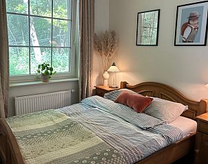 Vakantiehuis in Nutter, knusse slaapkamer met houten meubels in vakantiehuis Twente, Overijssel.