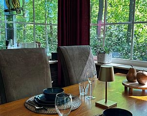 Vakantiehuis in Nutter, eetkamer met uitzicht op natuur in vakantiehuis Twente, Overijssel.