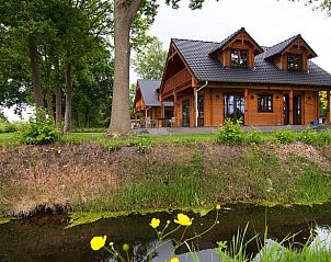 Huisje in Den Ham, vakantiehuis in Twente, Overijssel, omgeven door groene natuur en rustieke charme, ideaal voor een ontspannen verblijf.