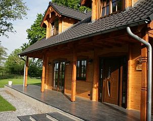 Veranda van Vakantiehuis in Den Ham, Twente, Overijssel met tuinzicht.
