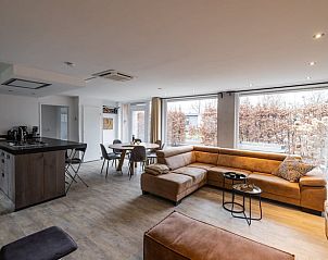Cozy indoor area of cottage in Den Ham, Twente. Comfortable sitting area with views of nature in Overijssel.