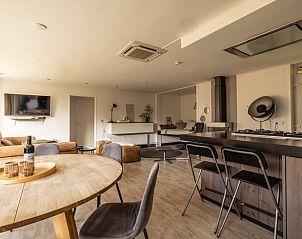 Cozy indoor area of Holiday Home in Den Ham, Twente, with modern kitchen and comfortable seating area in Overijssel.