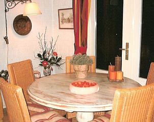 Cozy dining room in vacation home at Recreatiepark Noordikhoeve in Reutum, Twente, Overijssel. Perfect for family dinners.