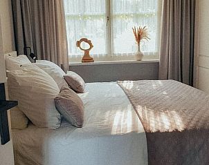 Comfortabele slaapkamer in Huisje in Rijssen, vakantieaccommodatie in Twente, Overijssel, met zacht beddengoed.